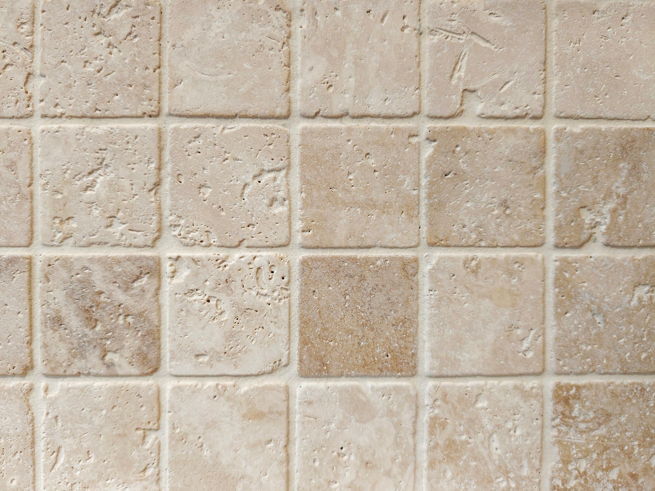 Close-up of beige travertine tiles